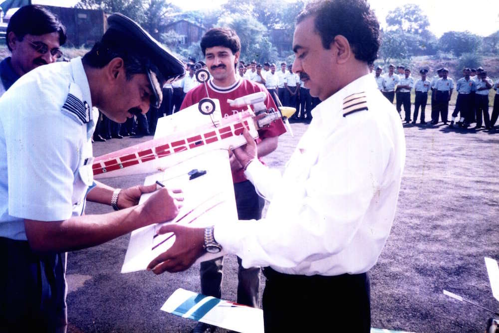 Chief of Airforce Station Madh Island, Mumbai giving autograph after air show conducted by Capt A.D Manek
                 on celebration of Air Force Day 8th October 1998