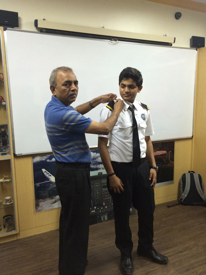 Cadet Mohit Marwadi - latest 2015 batch student felicitated by Capt A.D Manek with student Pilot appulets